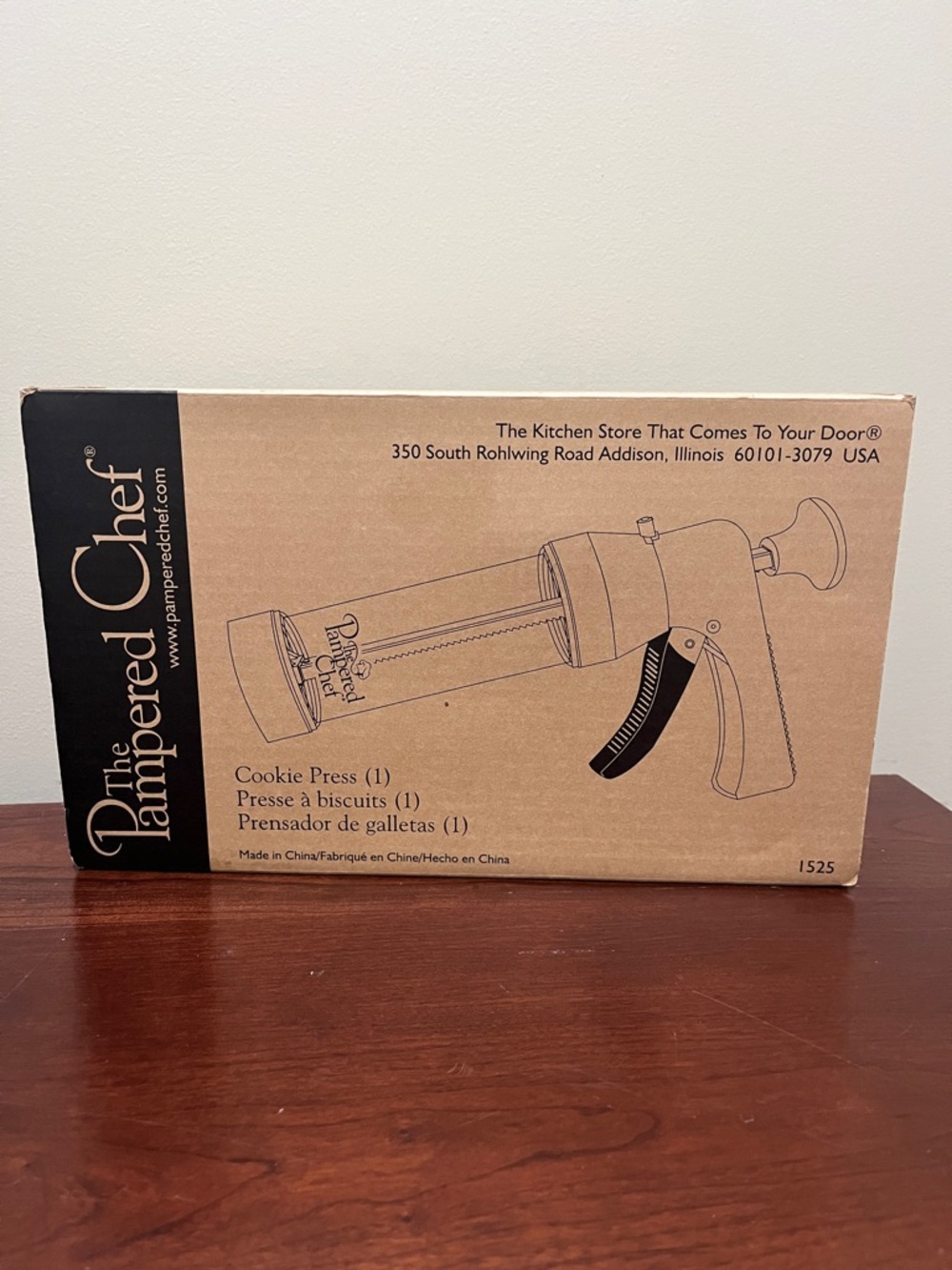 The Pampered Chef Cookie Press w/16 cookie patterns and recipes.